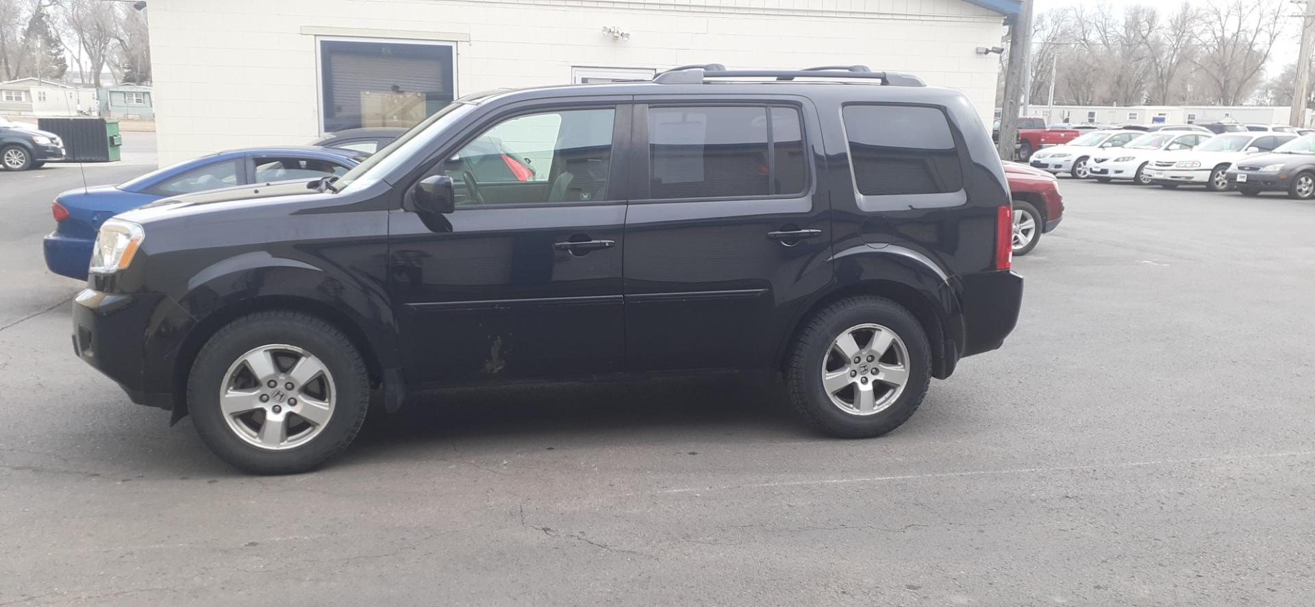 2011 Honda Pilot EX-L 4WD 5-Spd AT (5FNYF4H55BB) with an 3.5L V6 SOHC 24V engine, 5-Speed Automatic transmission, located at 2015 Cambell Street, Rapid City, SD, 57701, (605) 342-8326, 44.066433, -103.191772 - CARFAX AVAILABLE - Photo#0